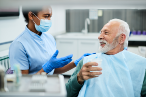 a patient chatting with a dental assistant