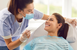 a dental assistant chatting with a patient 